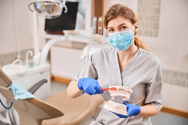 dentist showing teeth cleaning