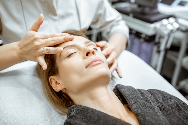 Woman during the facial massage at the beaty salon